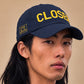 CLOSER low profile hat, yellow on navy, on model