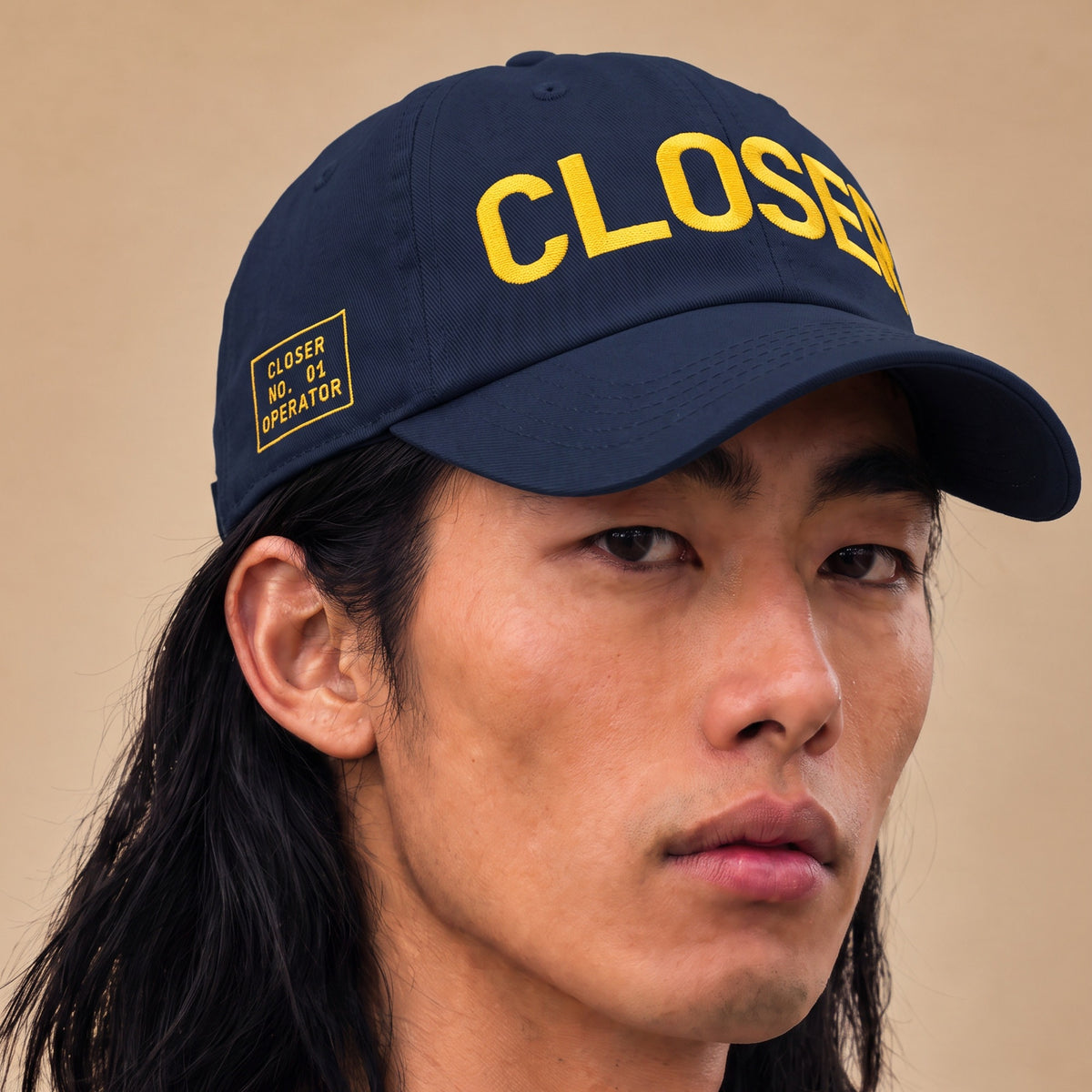 CLOSER low profile hat, yellow on navy, on model