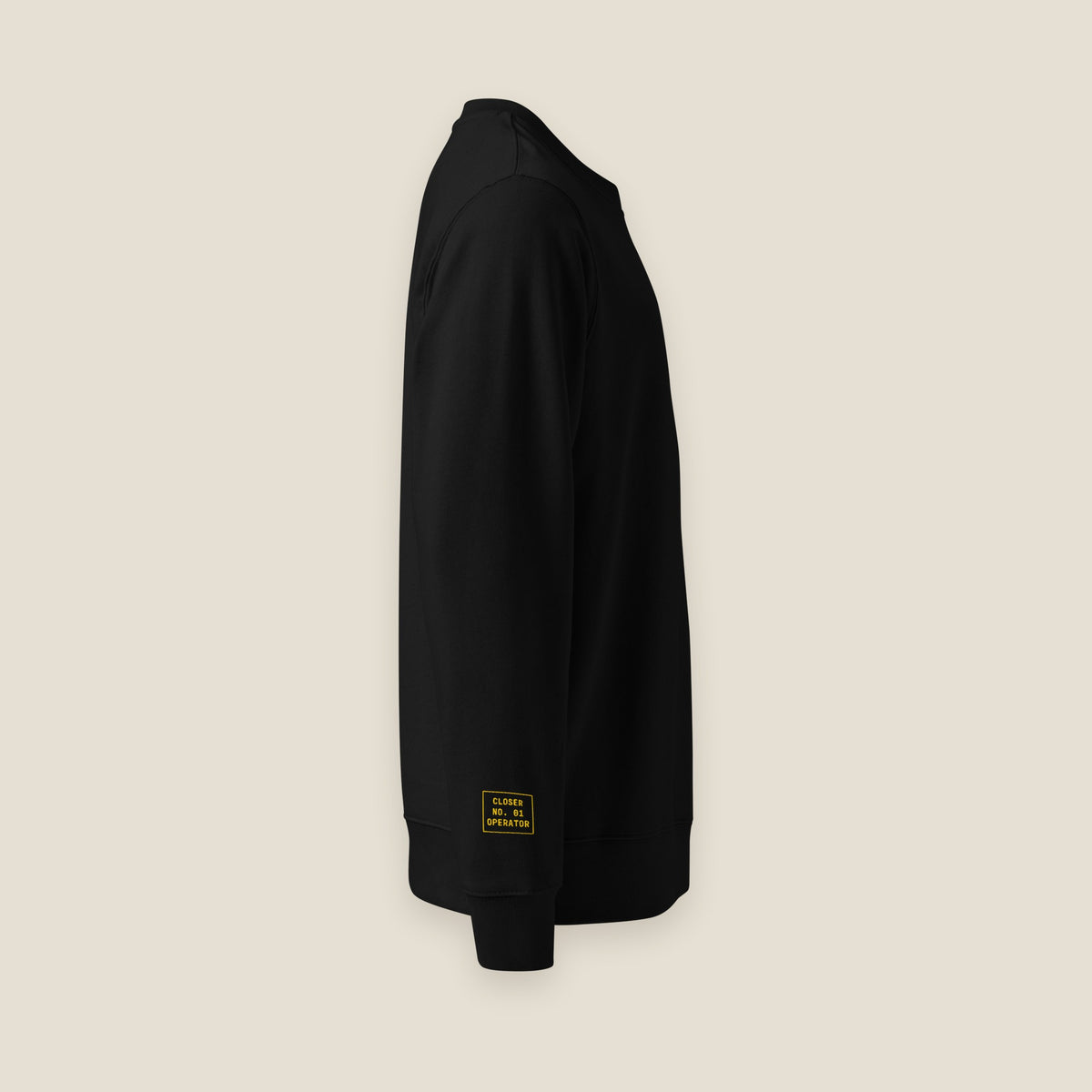 DØM black crewneck, side view with CLOSER NO. 01 OPERATOR sleeve tag